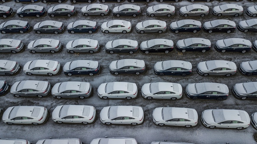 FILE - In this Dec. 5, 2018 file photo, hundreds of Chevrolet Cruze cars sit in a parking lot at General Motors&#039; assembly plant in Lordstown, Ohio. The long-struggling Rust Belt community of Youn ...
