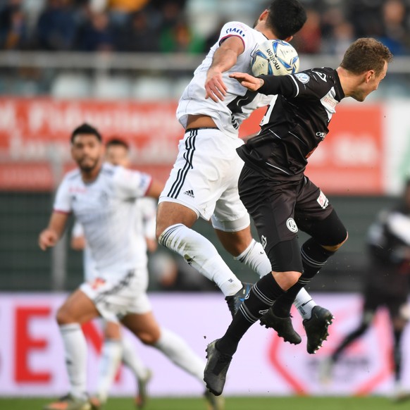 Basel&#039;s player Eray Ervin Coemert, left, fight for the ball with Lugano&#039;s player Alexander Gerndt, right, during the Super League soccer match FC Lugano against FC Basel, at the Cornaredo St ...