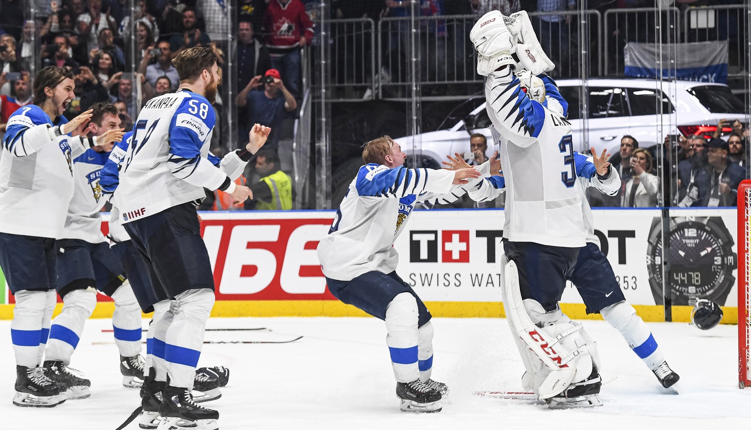 epa07604215 Players of Finland celebrate after winning the IIHF World Championship ice hockey final between Canada and Finland at the Ondrej Nepela Arena in Bratislava, Slovakia, 26 May 2019. Finland  ...