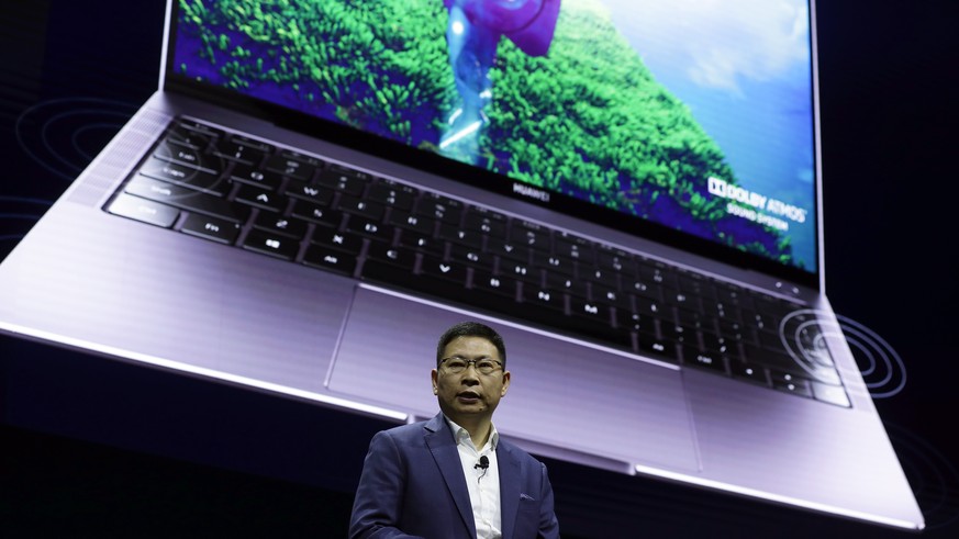 Huawei CEO Richard Yu presents a new Huawei MateBook X Pro laptop at the Mobile World Congress, in Barcelona, Spain, Sunday, Feb. 24, 2019. The fair started with press conferences on Sunday, before th ...