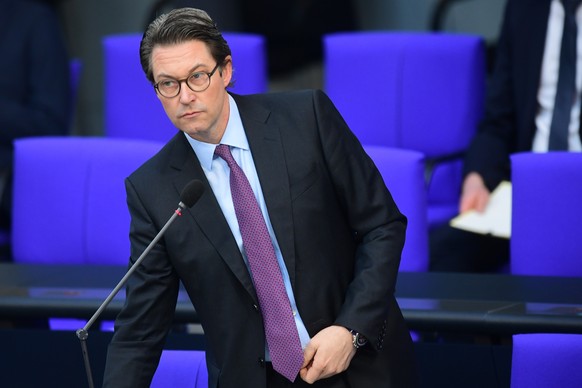 epa09048429 German Minister of Transport and Digital Infrastructure Andreas Scheuer speaks during a session of the German Bundestag in Berlin, Germany, 03 March 2021. Among other topics, Andreas Scheu ...