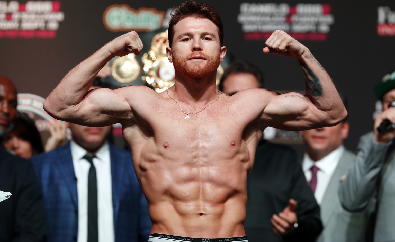 Canelo Alvarez, of Mexico, flexes onstage during an official weigh-in at T-Mobile Arena in Las Vegas Friday, Sept. 14, 2018. Alvarez will challenge WBC/WBA middleweight champion Gennady Golovkin of Ka ...