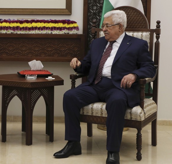 epa08152542 Palestinian President Mahmoud Abbas (R) meets with French President Emmanuel Macron at his headquarters in the the West Bank city of Ramallah 22 January 2020. Macron visits Ramallah after  ...