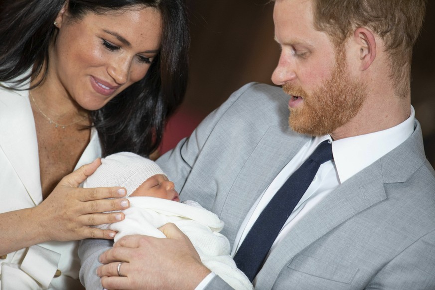 Britain&#039;s Prince Harry and Meghan, Duchess of Sussex, during a photocall with their newborn son, in St George&#039;s Hall at Windsor Castle, Windsor, south England, Wednesday May 8, 2019. Baby Su ...
