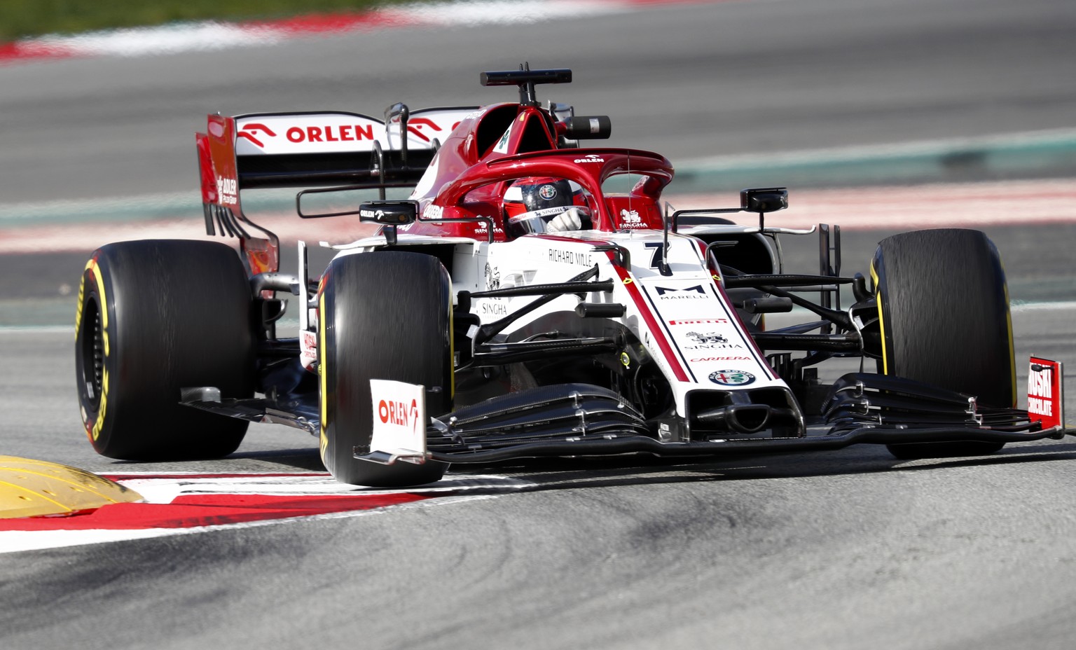 Alfa Romeo driver Kimi Raikkonen of Finland steers his car during the Formula One pre-season testing session at the Barcelona Catalunya racetrack in Montmelo, outside Barcelona, Spain, Friday, Feb. 28 ...