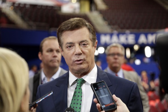 FILE - In this July 17, 2016 file photo, then-DonaldTrump Campaign Chairman Paul Manafort talks to reporters on the floor of the Republican National Convention, in Cleveland. House intelligence Commit ...