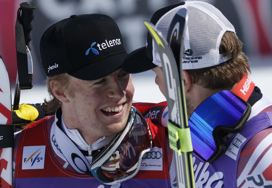 Norway&#039;s Alexsander Aamodt Kilde, left, is congratulated by teammate and runnerup Kjetil Jansrud at finish line after winning the men&#039;s super G cup at the Alpine Ski World Cup Finals, in St. ...
