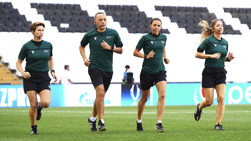 Assistant referee Michelle O&#039;Neill of Ireland, fourth official Cuneyt Cakir of Turkey, main referee Stephanie Frappart of France and assistant referee Manuela Nicolosi of France, from left, run d ...