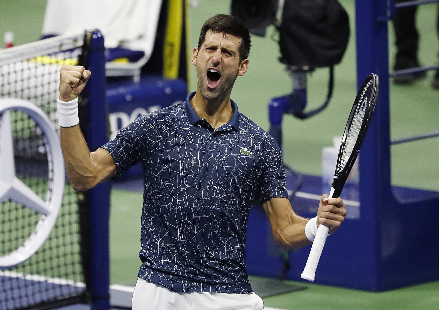 epa07004614 Novak Djokovic of Serbia reacts after defeating Kei Nishikori of Japan during their semi-final match on the twelfth day of the US Open Tennis Championships the USTA National Tennis Center  ...