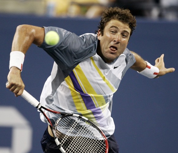 FILE - In this Aug. 28, 2007 file photo, Justin Gimelstob returns a shot to Andy Roddick at the US Open tennis tournament in New York. Now a tennis broadcaster and coach, Gimelstob faces a felony assa ...