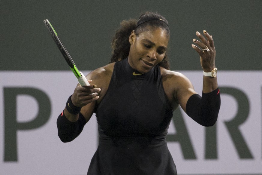Serena Williams, of the United States, reacts while playing Zarina Diyas, of Kazakhstan, during the first round of the BNP Paribas Open tennis tournament in Indian Wells, Calif., Thursday, March 8, 20 ...