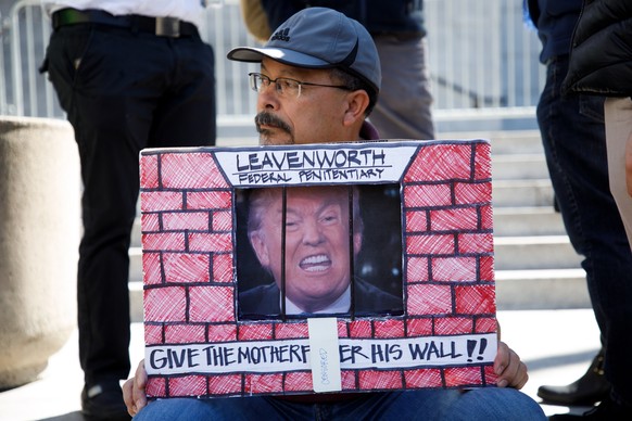 epa07379611 Demonstrators rally against the proposed border wall emergency declaration by US President Donald J. Trump at a Presidents Day protest in Los Angeles, California, USA, 18 February 2019. Th ...
