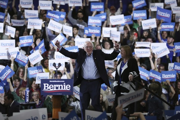 Democratic presidential candidate Sen. Bernie Sanders, I-Vt., accompanied by his wife Jane O&#039;Meara Sanders, speaks during a primary night election rally in Essex Junction, Vt., Tuesday, March 3,  ...