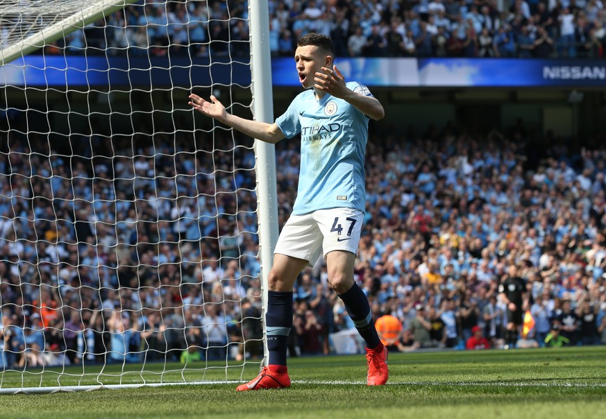 epa07517287 Manchester City&#039;s Phil Foden celebrates scoring a goal during the English Premier League soccer match between Manchester City and Tottenham Hotspur at the Etihad Stadium in Manchester ...