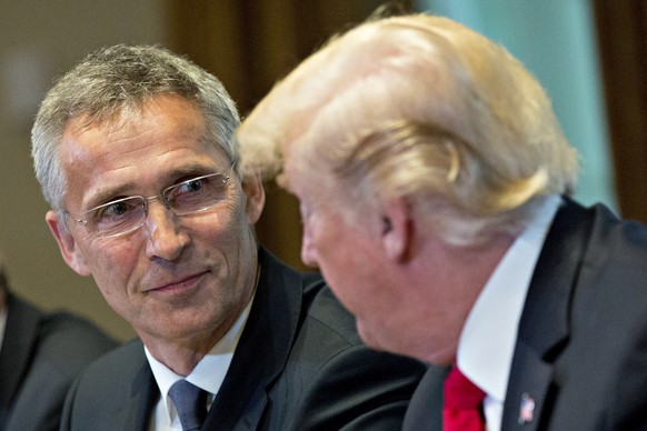 epa06745706 Jens Stoltenberg, secretary general of the North Atlantic Treaty Organization (NATO), listens as US President Donald J. Trump, right, speaks during a meeting in the Cabinet Room of the Whi ...