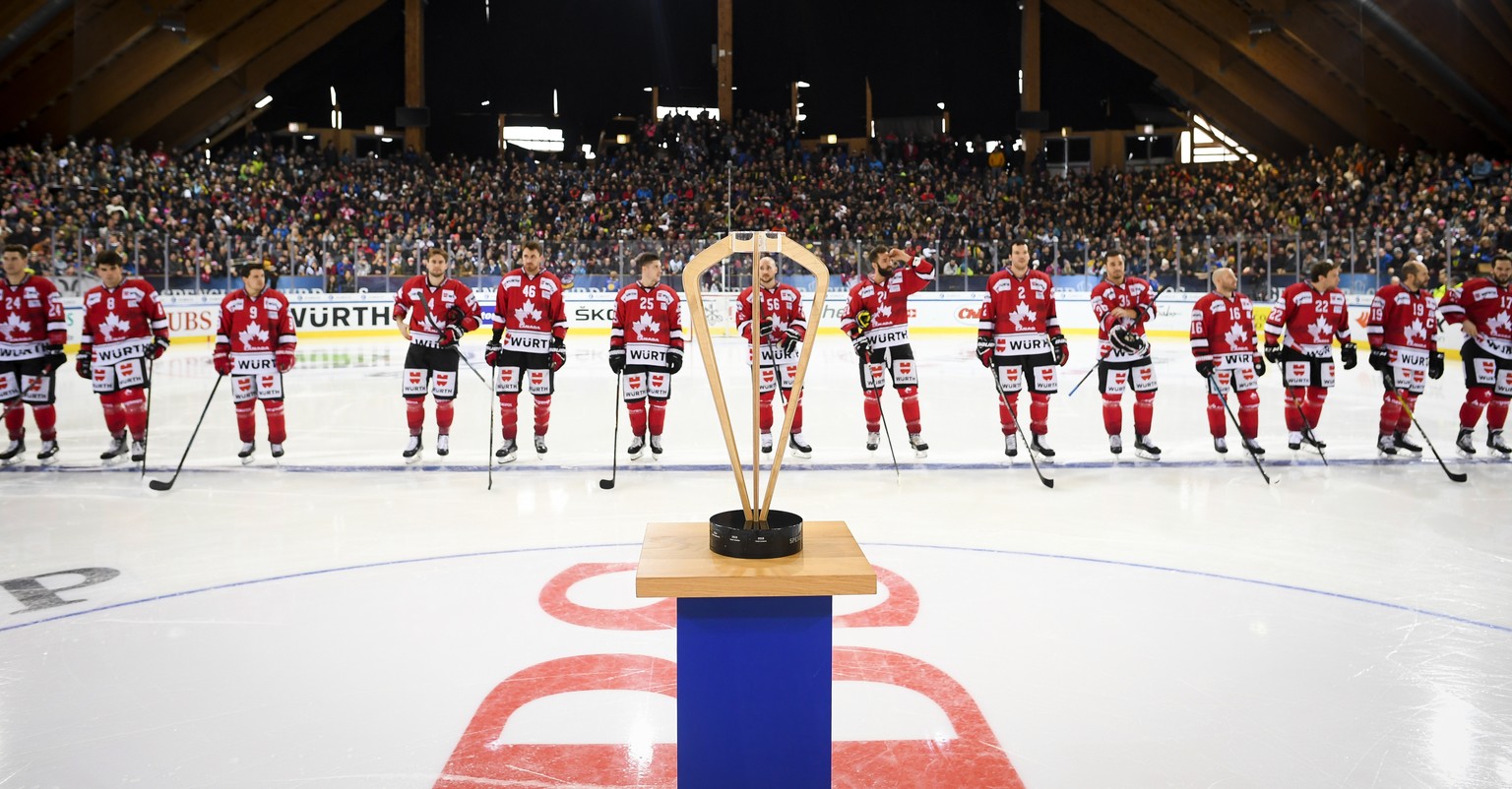 Team Canada lines up in front of the trophy prior the final game between Team Canada and KalPa Kuopio Hockey Oy at the 92th Spengler Cup ice hockey tournament in Davos, Switzerland, Monday, December 3 ...