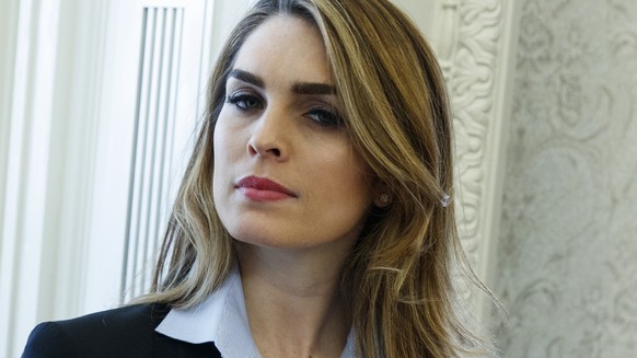 In this Feb. 9, 2018 photo, White House Communications Director Hope Hicks is shown during a meeting in the Oval Office between President Donald Trump and Shane Bouvet, in Washington. Hicks, one of Pr ...