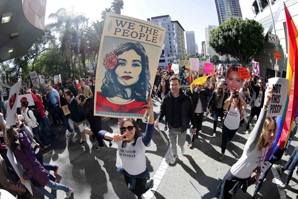 epaselect epa05739858 Over a 100,000 demonstrators participate in the Woman&#039;s March in Los Angeles, California, USA, 21 January 2017 to protest Donald J. Trump who took the oath of office and was ...