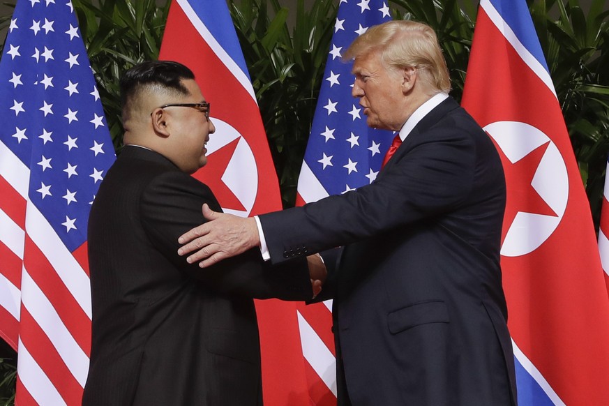 FILE - In this June 12, 2018, file photo, U.S. President Donald Trump shakes hands with North Korea leader Kim Jong Un at the Capella resort on Sentosa Island, in Singapore. (AP Photo/Evan Vucci, File ...