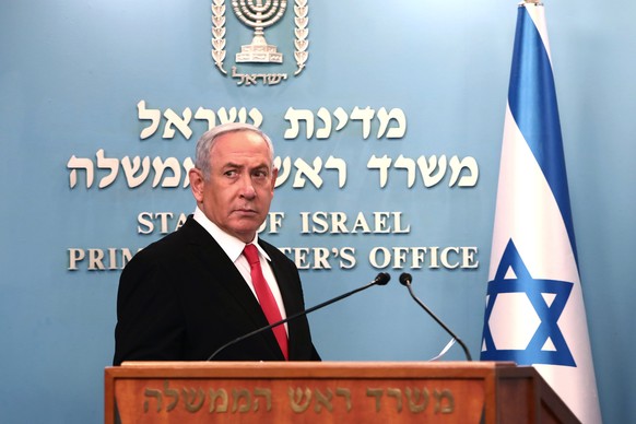 epa08294783 Israeli Prime Minister Benjamin Netanyahu gives a speech regarding the new measures that will be taken to fight the Corona virus in Israel, at his Jerusalem office, 14 March 2020. Netanyah ...