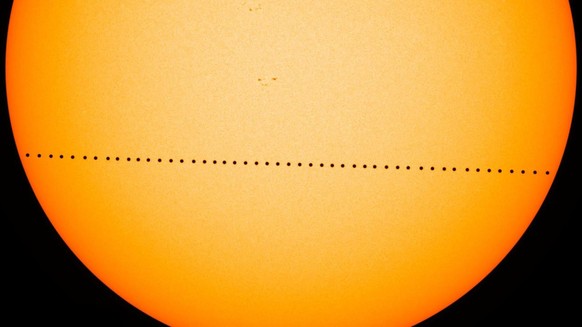 In this composite image provided by NASA, the planet Mercury passes directly between the sun and Earth on May 9, 2016 in a transit which lasted seven-and-a-half-hours. On Monday, Nov. 11, 2019, Mercur ...