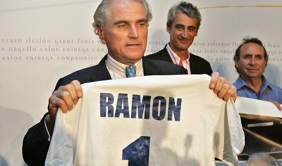 Ramon Calderon holds up a soccer shirt with his name on it after winning the Real Madrid presidential elections in Madrid, Sunday, July 2, 2006. Real Madrid members voted Sunday for a new president wh ...