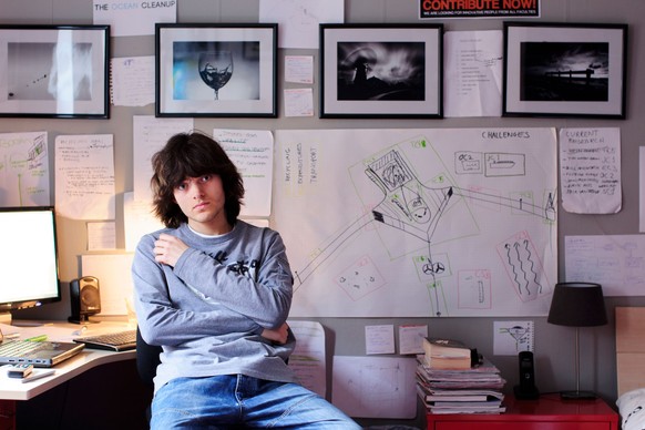 In this March 3rd, 2013, photo provided by The Ocean Cleanup shows its CEO and Founder Boyan Slat, a Dutch entepreneur and inventor working from his bedroom before The Ocean Cleanup had an office in D ...