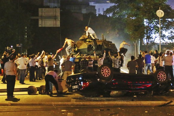 Tanks move into position as Turkish people attempt to stop them, in Ankara, Turkey, early Saturday, July 16, 2016. Turkey&#039;s armed forces said it &quot;fully seized control&quot; of the country Fr ...