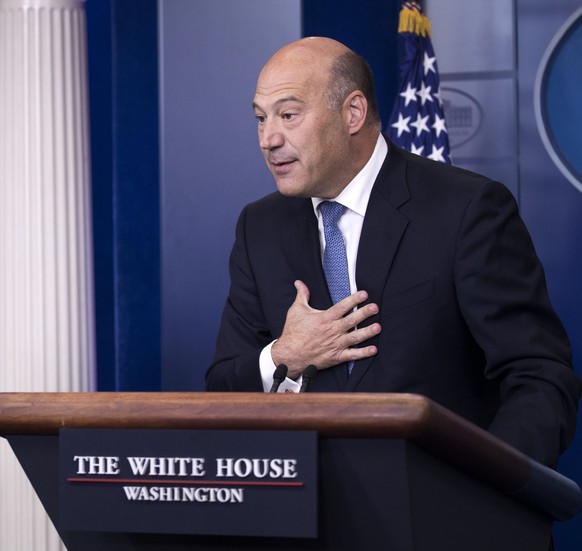 epaselect epa06233081 Director of the National Economic Council Gary Cohn (R) responds to a question from the news media watched by White House Press Secretary Sarah Huckabee Sanders during the White  ...