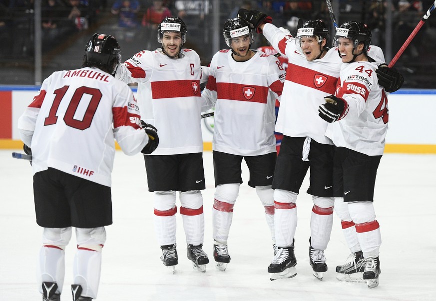 epa05949401 Players of Switzerland celebrate a goal during the 2017 IIHF Ice Hockey World Championship group B preliminary round match between Norway and Switzerland in Paris, France, 07 May 2017. EPA ...