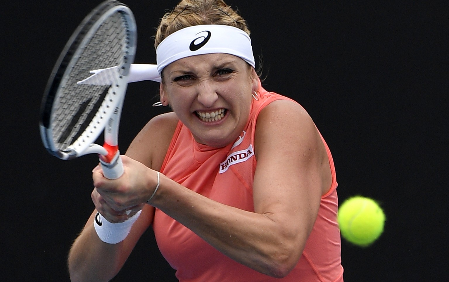 Switzerland&#039;s Timea Bacsinszky makes a backhand return to Russia&#039;s Daria Kasatkina against during their first round match at the Australian Open tennis championships in Melbourne, Australia, ...