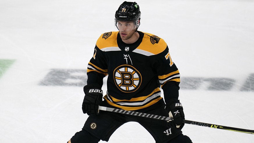 Boston Bruins left wing Taylor Hall, who was acquired in a trade with the Buffalo Sabres, stretches during warmups for the team&#039;s NHL hockey game against his former team, Tuesday, April 13, 2021, ...