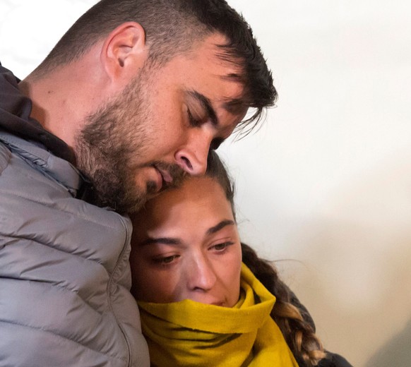 epa07316796 Jose Rosello (L) and Vicky Garcia (R), parents of two-year-old Julen, who fell down a 110-meters-well, react during a vigil in Totalan, Malaga, Spain, 24 January 2019. The excavation works ...