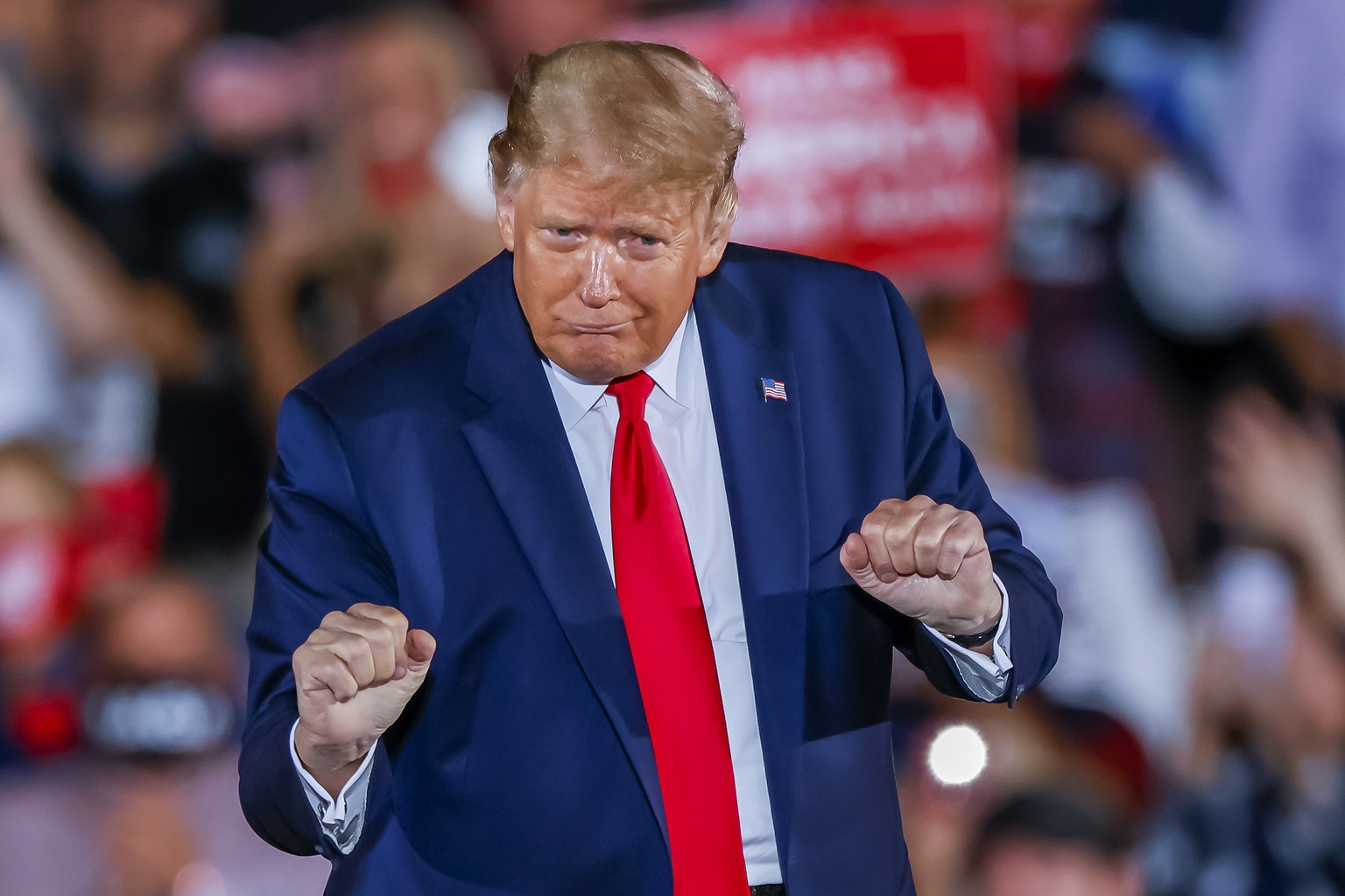 epa08751742 US President Donald J. Trump dances after speaking during his Make America Great Again Rally campaign event at Middle Georgia Regional Airport in Macon, Georgia, USA, 16 October 2020. Trum ...