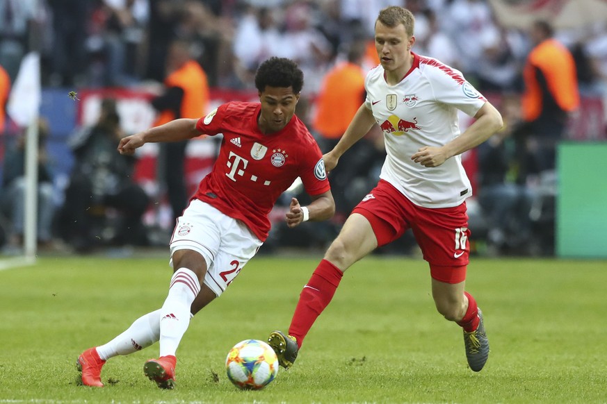 Leipzig&#039;s Lukas Klostermann, right, fights for the ball with Bayern&#039;s Serge Gnabry during the German soccer cup, DFB Pokal, final match between RB Leipzig and Bayern Munich at the Olympic st ...