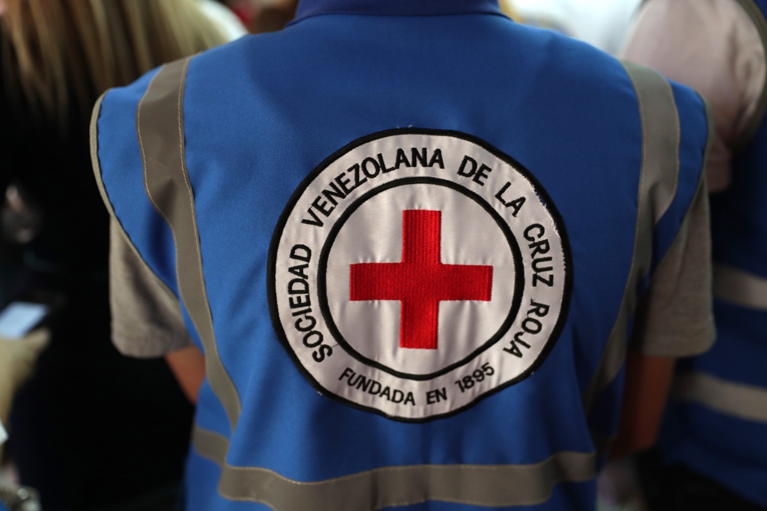 epa07471568 A person wears a vest of the Venezuelan Red Cross during a press conference of the president of the International Federation of Red Cross and Red Crescent Societies (IFRC) Francesco Rocca  ...