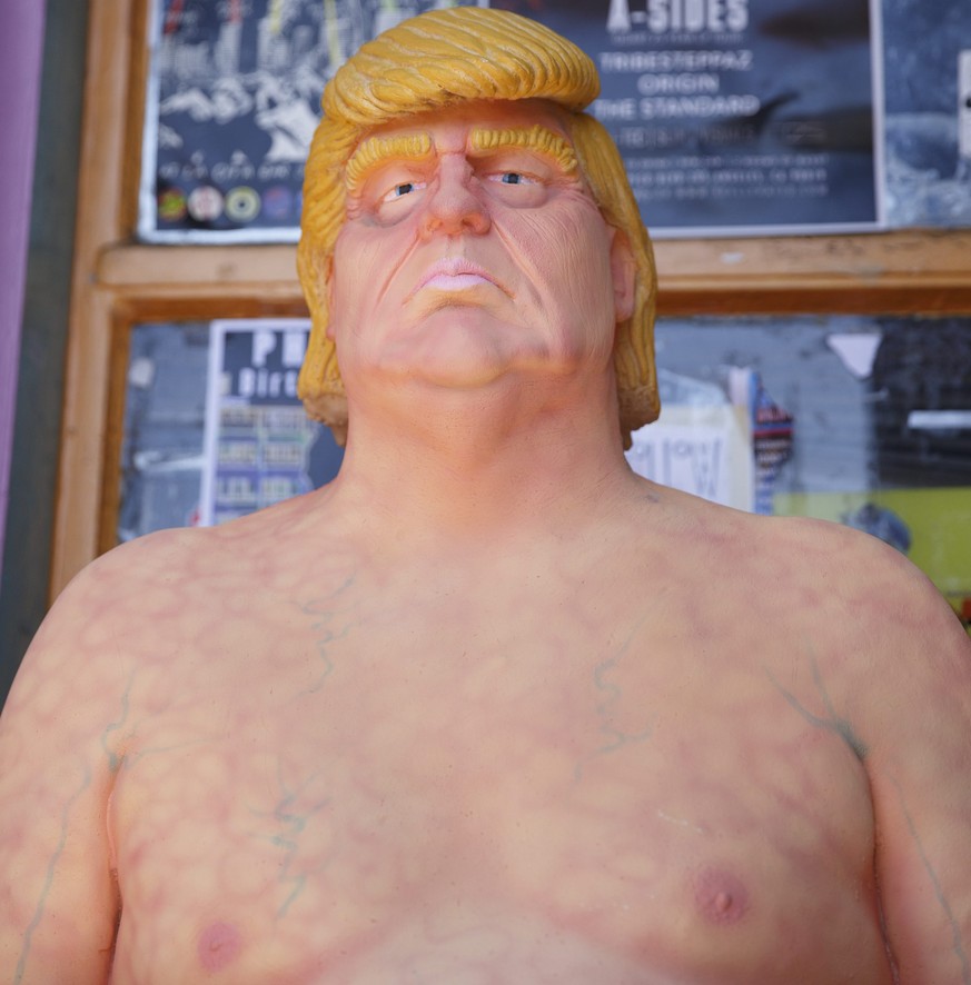 epa05497424 A naked Donald Trump statue after being unveiled around the USA including in Los Angeles, California, USA, 18 August 2016. The unauthorized art installation was created by INDECLINE, a sel ...