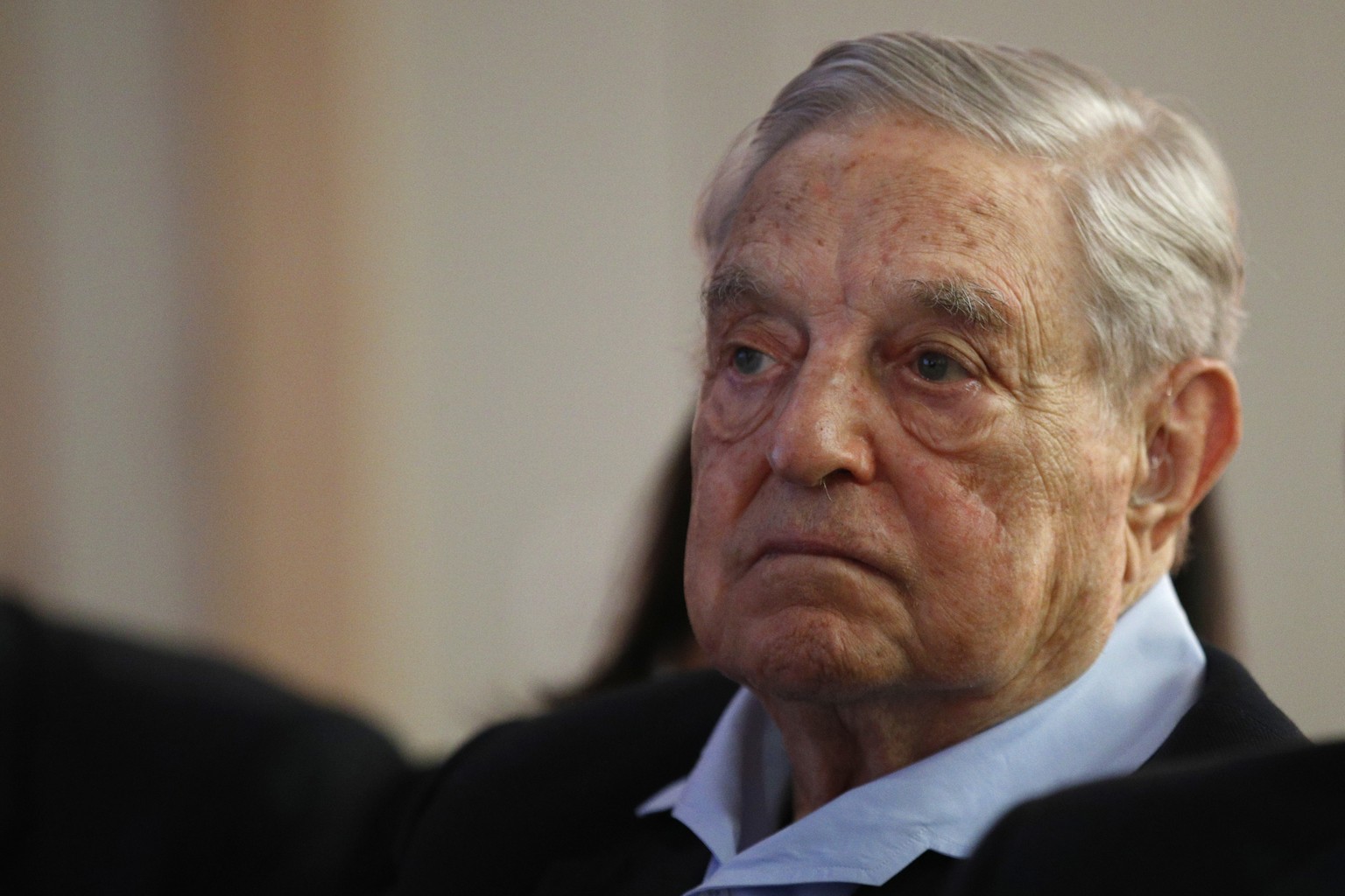 FILE- In this May 29, 2018, file photo George Soros, Founder and Chairman of the Open Society Foundations listens to the conference after his speech entitled &quot;How to save the European Union&quot; ...