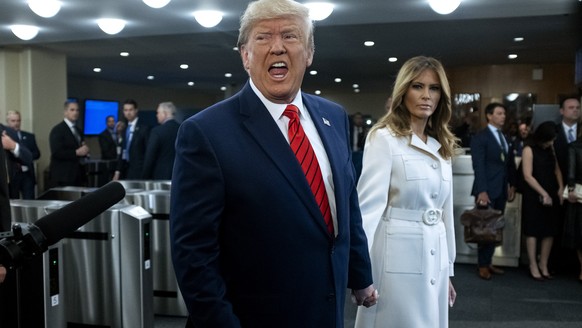 U.S. President Donald Trump addresses reporters as he arrives with first lady Melania Trump for the 74th session of the United Nations General Assembly, at U.N. headquarters, Tuesday, Sept. 24, 2019.  ...