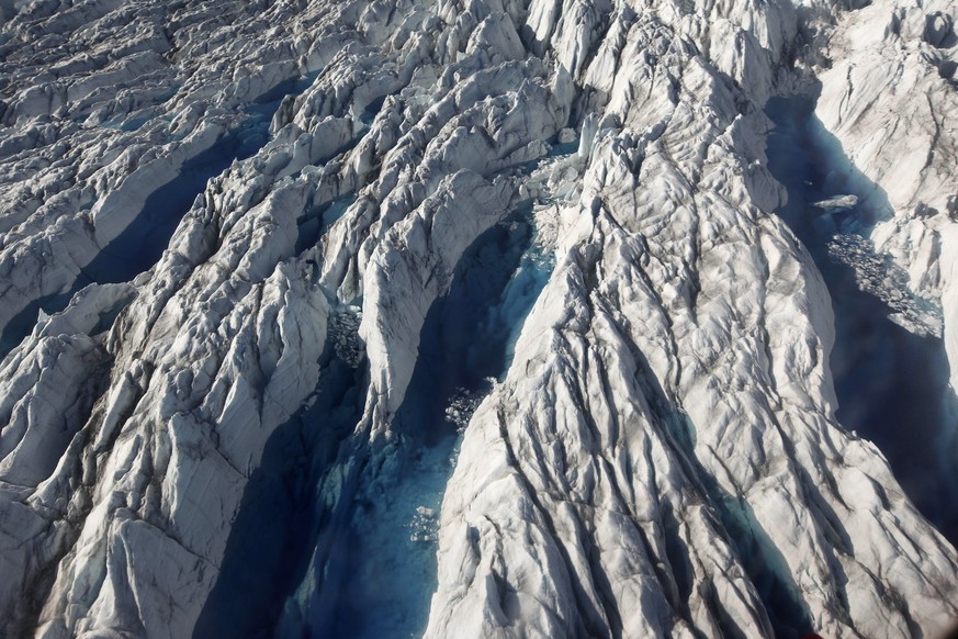 FILE - In this July 19, 2011 file photo, pools of melted ice form atop Jakobshavn Glacier, near the edge of the vast Greenland ice sheet. Since 1997, the West Antarctic and Greenland ice sheets have l ...