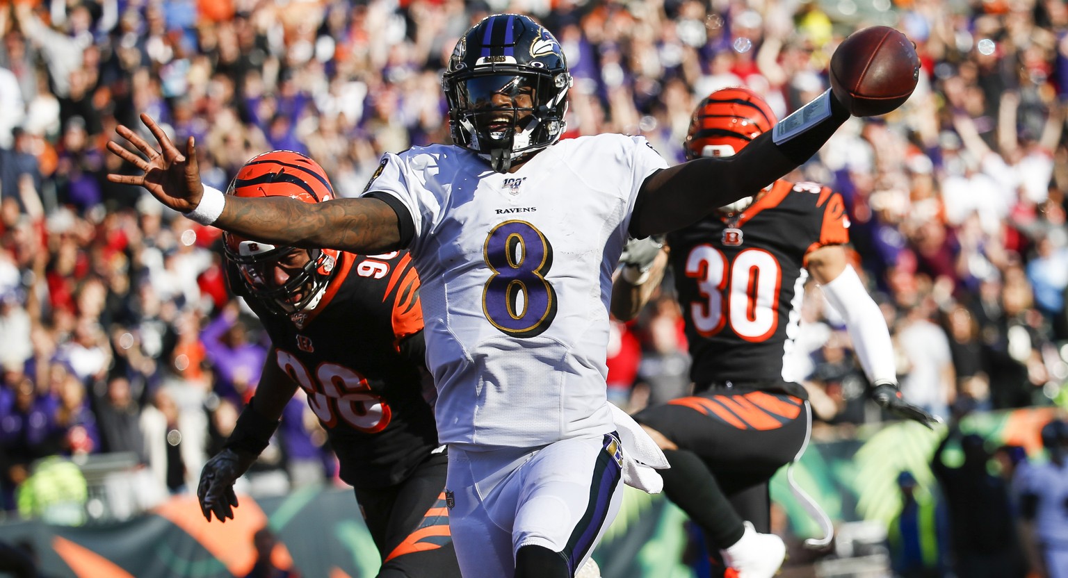Baltimore Ravens quarterback Lamar Jackson (8) celebrates his touchdown during the second half of NFL football game against the Cincinnati Bengals, Sunday, Nov. 10, 2019, in Cincinnati. (AP Photo/Fran ...