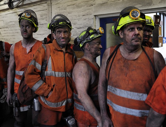 Miners come off the last shift at Kellingley Colliery in Knottingley, northern England, on the final day of production, Friday Dec. 18, 2015. Once, coal fueled the British Empire, employed armies of m ...