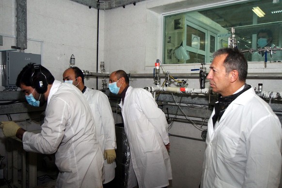 epa04032740 An IAEA team checks the enrichment process inside the uranium enrichment plant Natanz in central Iran on 20 January 2014. The aim of the inspectors was to check whether Iran would fulfill  ...