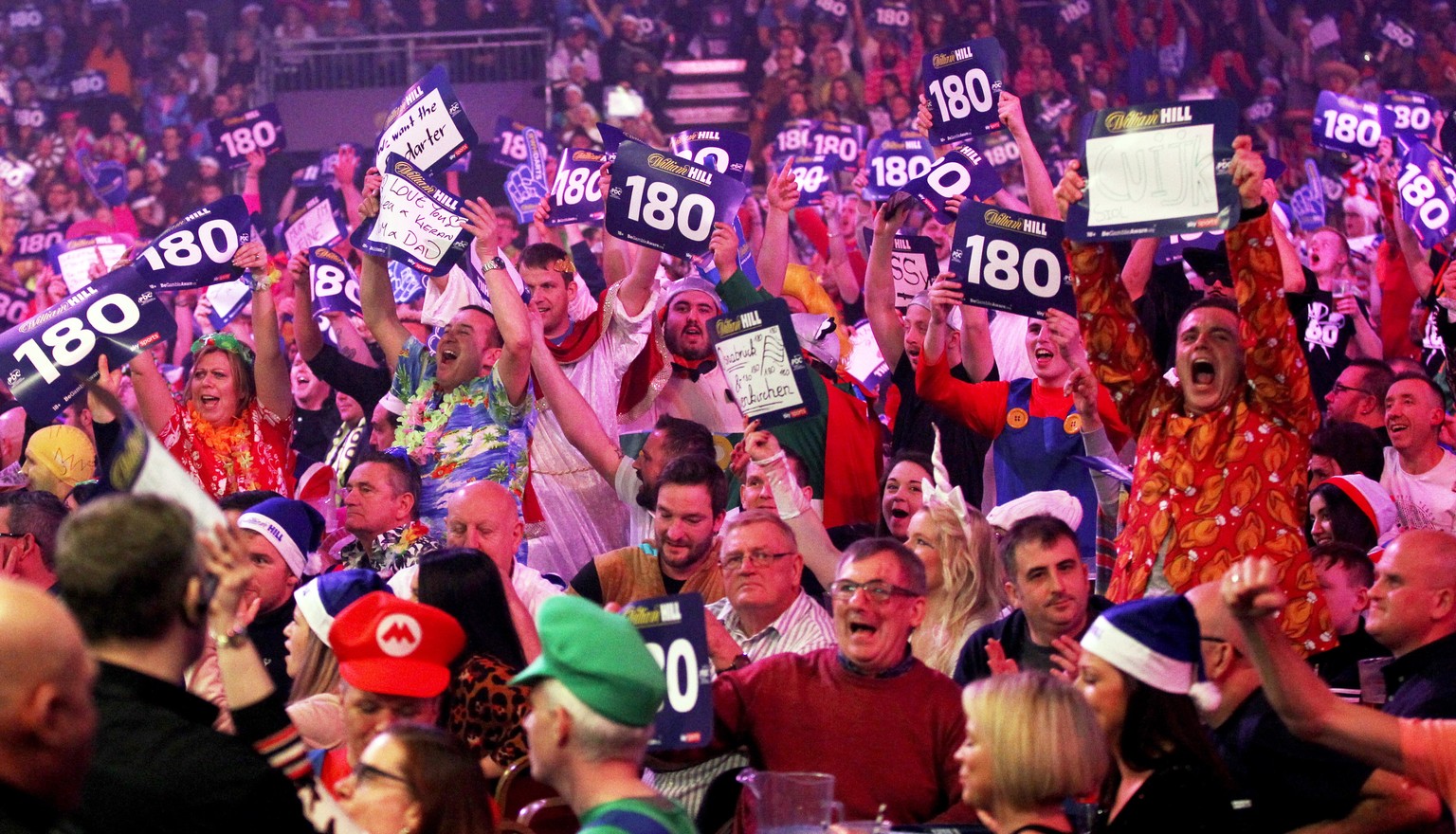 epa07257548 Fans react during the PDC World Championship final match between British Michael Smith and Dutch Michael van Gerwen at the Alexander Palace in North London, Britain, 01 January 2019. EPA/S ...