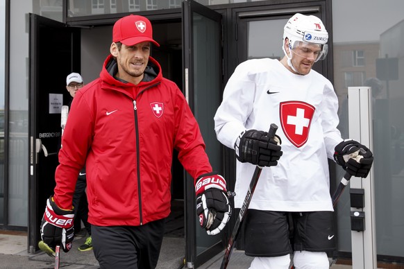 Patrick Fischer, left, head coach of Switzerland national ice hockey team, and Switzerland&#039;s defender Joel Genazzi, right, arrive for a training session, at the IIHF 2018 World Championship at th ...