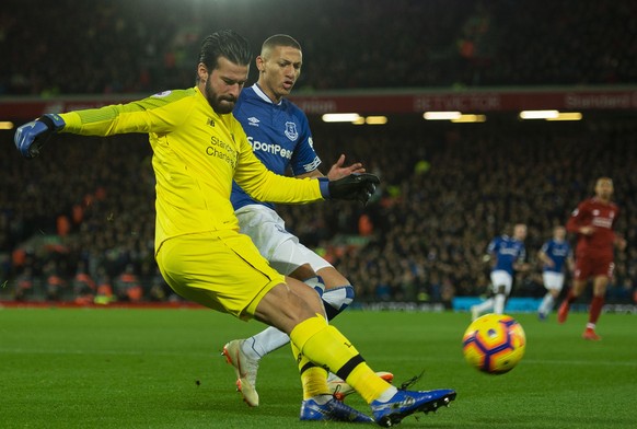 epa07204037 Liverpool&#039;s goalkeeper Alisson Becker (L) in action with Everton&#039;s Richarlison (R) during the English Premier League soccer match between Liverpool and Everton at the Anfield in  ...