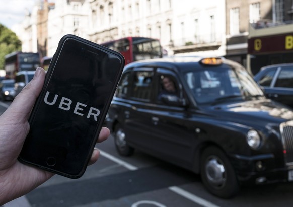 epa06355410 (FILE) - An image showing an Uber app on a mobile phone in central London, Britain, 22 September 2017. Media reports on 28 November 2017 state Japanese Softbank corporation may be close to ...