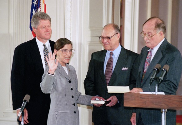 FILE - In this Aug. 10, 1993, file photo, Supreme Court Justice Ruth Bader Ginsburg takes the court oath from Chief Justice William Rehnquist, right, during a ceremony in the East Room of the White Ho ...