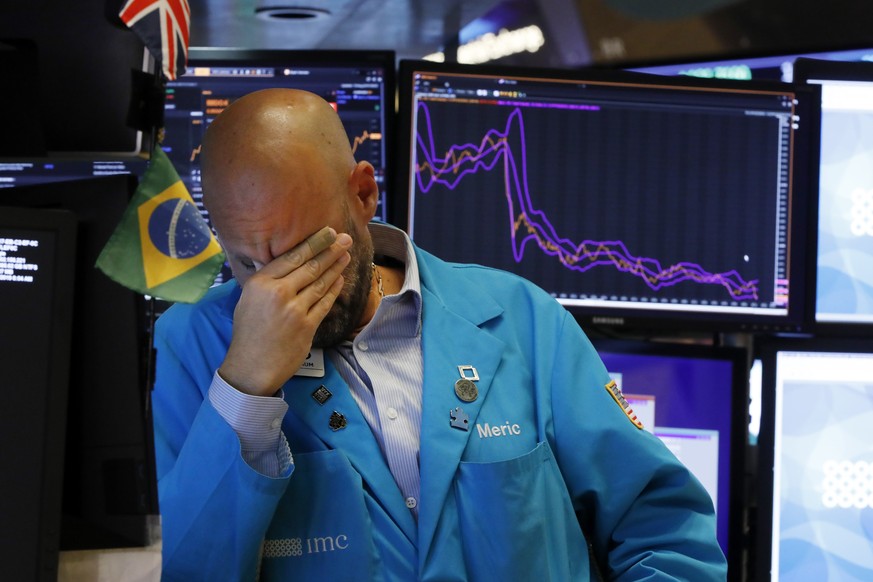 Specialist Meric Greenbaum works on the floor of the New York Stock Exchange, Friday, Aug. 23, 2019. Stocks tumbled on Wall Street after President Donald Trump said he &quot;hereby ordered&quot; U.S.  ...