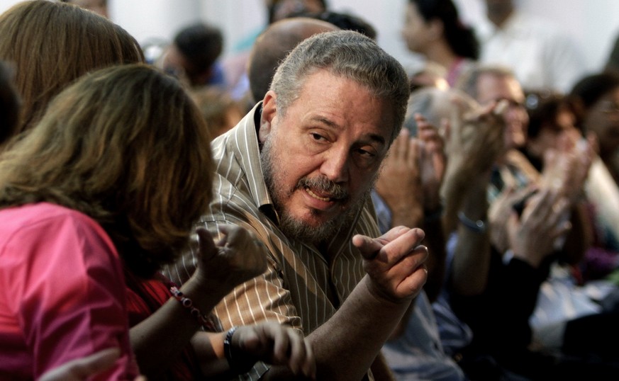 FILE - In this March 14, 2012 file photo, Fidel Castro Diaz-Balart, son of then Cuban leader Fidel Castro, speaks with an unidentified woman during the presentation of his father&#039;s book &quot;Nue ...